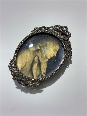 Lot 2416 - An early 19th century verre eglomise portrait...