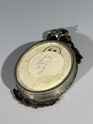Lot 2416 - An early 19th century verre eglomise portrait...