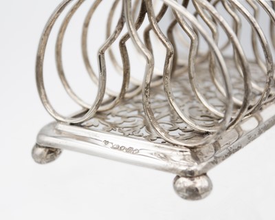 Lot 28 - An early Victorian silver six section toast rack by Edward & John Barnard.