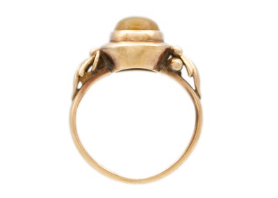 Lot 21 - A rose gold fire opal set ring.