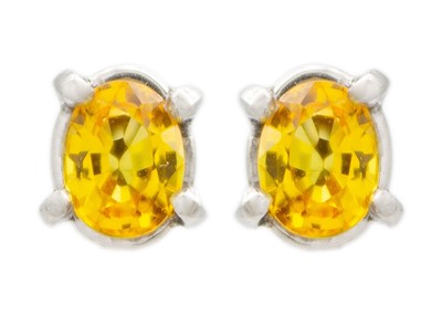 Lot 139 - A pair of yellow sapphire ear studs, 1.8ct total, set in .999 platinum.