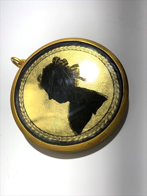 Lot 2419 - A verre eglomise silhouette portrait of a lady,...