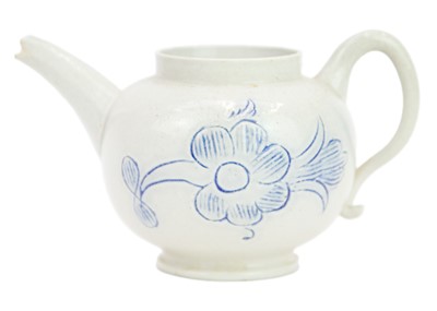 Lot 365 - A miniature saltglaze teapot.