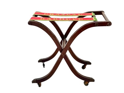 Lot 878 - A folding mahogany luggage rack.