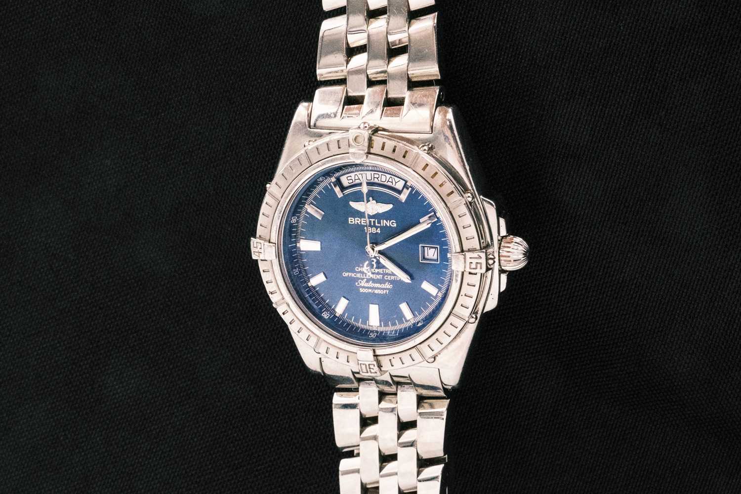 Lot 92 - BREITLING - A Windrider Headwind, a gentleman's stainless steel automatic bracelet watch.