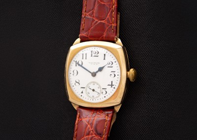 Lot 66 - WALTHAM - A 9ct cased 1930's cushion cased gentleman's manual wind wristwatch.