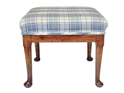 Lot 666 - A George III elm stool.