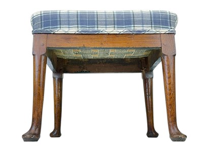 Lot 666 - A George III elm stool.