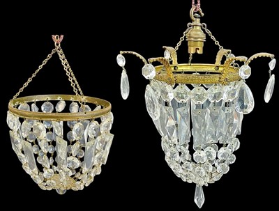 Lot 570 - A gilt metal and cut glass chandelier.