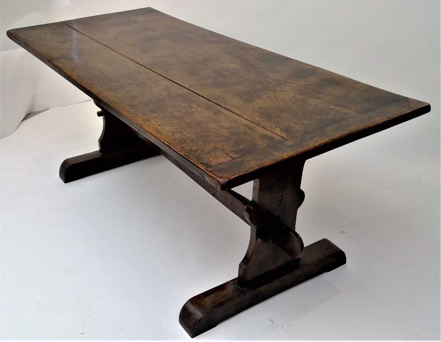 Lot 3502 - An elm refectory table, the rectangular top on...