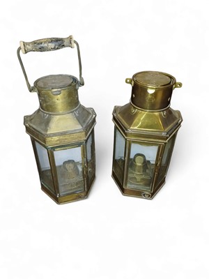 Lot 528 - Two brass bulkhead lamps.