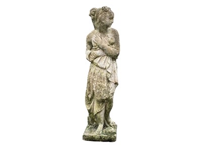 Lot 824 - A reconstituted stone emblematic figure of winter.