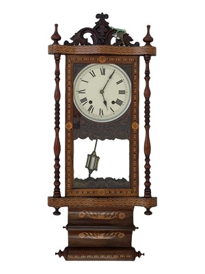 Lot 530 - An American ornate rosewood and inlaid wall clock.