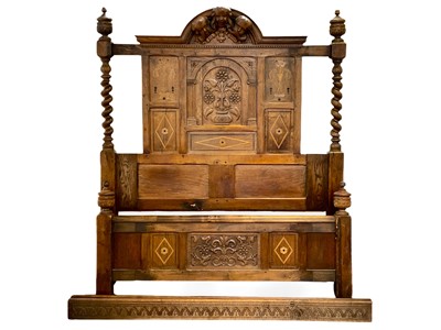 Lot 859 - Frank Rosier, an impressive oak, carved and inlaid half-tester bedstead.