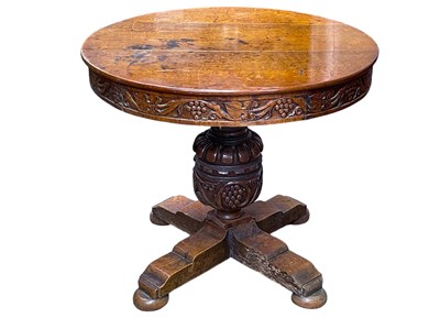 Lot 856 - Frank Rosier, A carved oak circular centre table, in the 17th century taste.