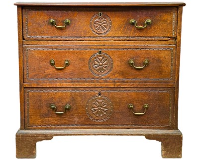 Lot 861 - A George III small oak chest.