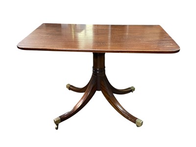 Lot 657 - A Regency style mahogany dining table.