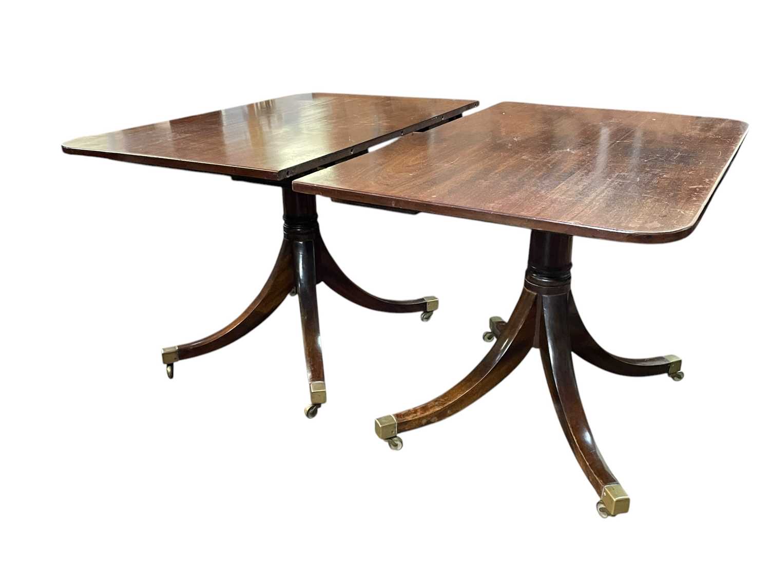 Lot 657 - A Regency style mahogany dining table.