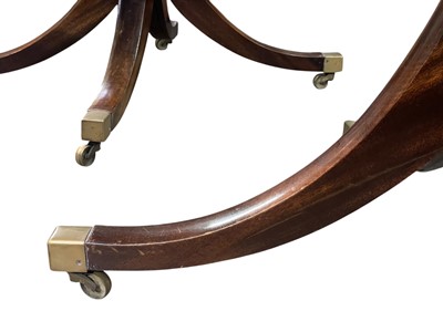 Lot 657 - A Regency style mahogany dining table.