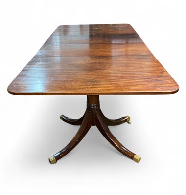 Lot 657 - A Regency style mahogany dining table.