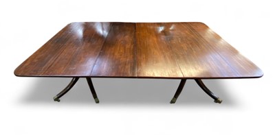 Lot 657 - A Regency style mahogany dining table.