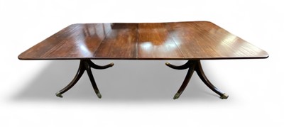 Lot 657 - A Regency style mahogany dining table.