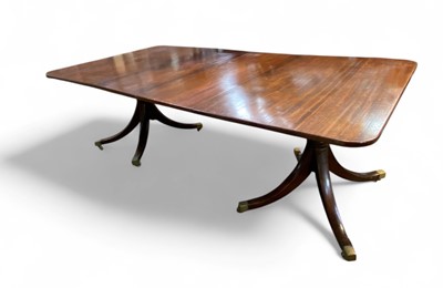 Lot 657 - A Regency style mahogany dining table.