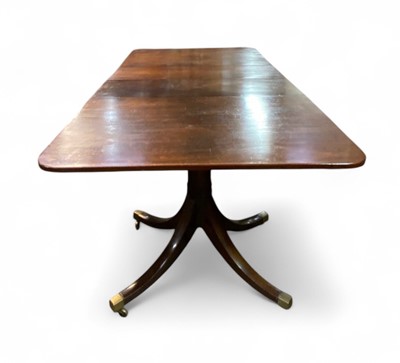 Lot 657 - A Regency style mahogany dining table.