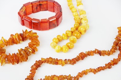 Lot 285 - Two amber bead necklaces and two amber bracelets.