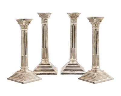 Lot 44 - A good set of four George V Corinthian column candlesticks by John Price Hunt.