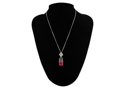 Lot 22 - A rare bi-colour tourmaline and diamond pendant, set in 18ct white gold.