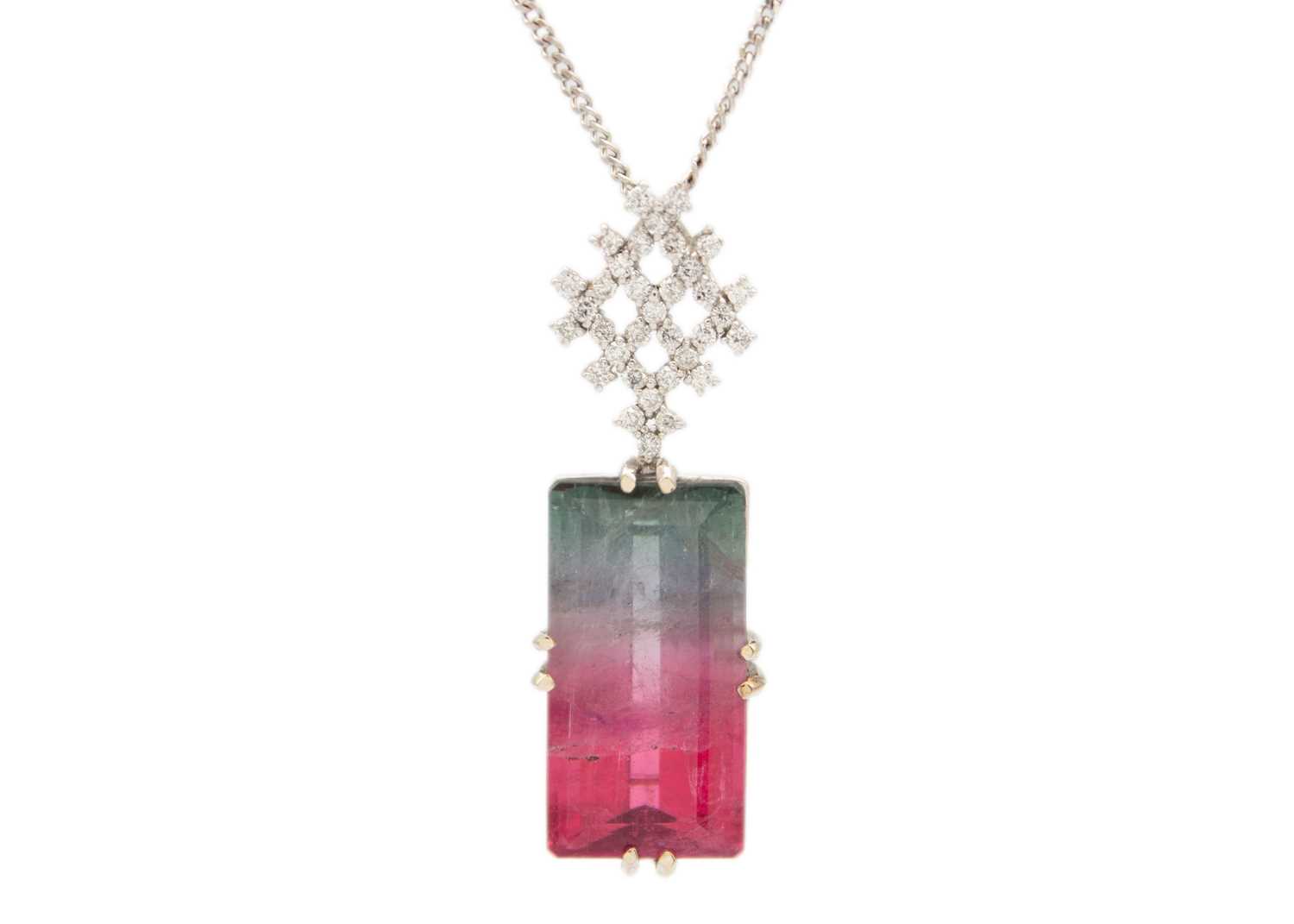 Lot 22 - A rare bi-colour tourmaline and diamond pendant, set in 18ct white gold.