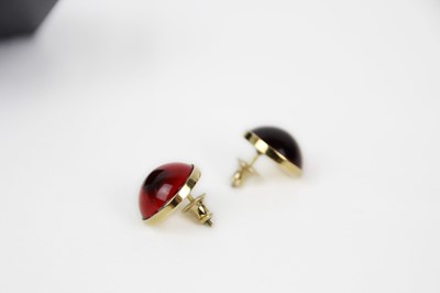 Lot 284 - Lalique - A pair of modern cabochon red crystal stud earrings.