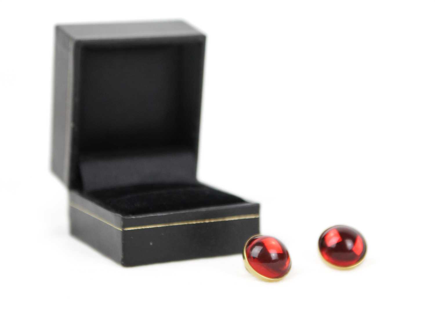 Lot 284 - Lalique - A pair of modern cabochon red crystal stud earrings.