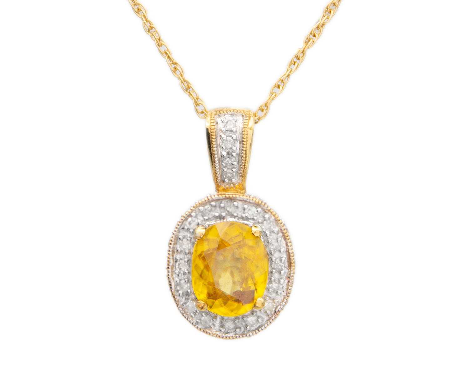 Lot 16 - A 9ct yellow sphene (titanite) and diamond cluster pendant on a 9ct necklace.