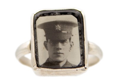 Lot 134 - An unusual WWI silver photographic portrait mourning ring.