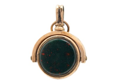 Lot 250 - A rose gold carnelian and bloodstone small swivel fob.