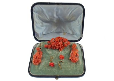 Lot 62 - A Victorian floral carved coral brooch and earring suite.