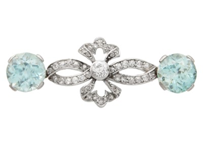 Lot 42 - An attractive early 20th-century diamond and blue zircon, white gold set brooch.