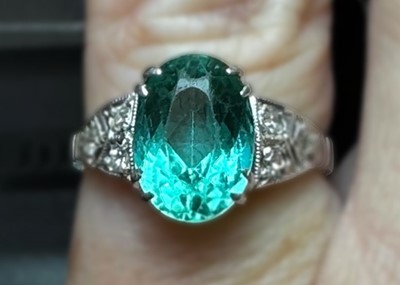 Lot 45 - A rare paraiba tourmaline of 2.15ct, set in a diamond set Art Deco 18ct white gold and platinum ring.