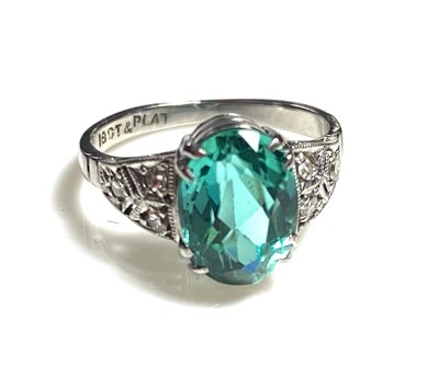 Lot 45 - A rare paraiba tourmaline of 2.15ct, set in a diamond set Art Deco 18ct white gold and platinum ring.