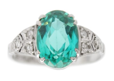 Lot 181 - A rare paraiba tourmaline of 2.15ct, in a diamond set Art Deco 18k white gold and platinum ring.