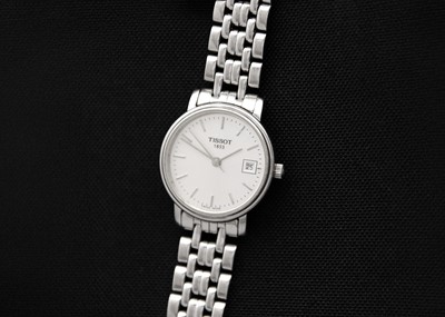 Lot 193 - TISSOT - A stainless steel lady's quartz bracelet wristwatch.