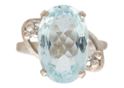 Lot 41 - A platinum aquamarine set dress ring.