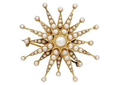 Lot 69 - A Victorian gold split pearl set star brooch.