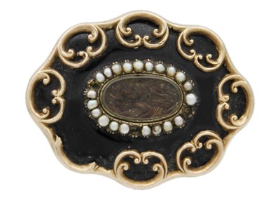 Lot 71 - A Victorian gold, black enamel and seed pearl set memorial brooch.