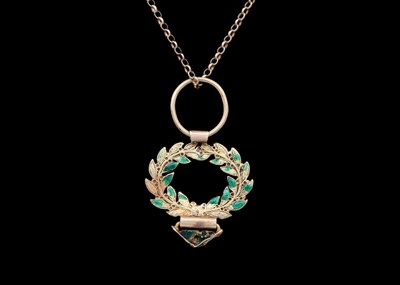 Lot 75 - A small 18ct (tested) green enamel applied wreath pendant, on a modern 9ct necklace.