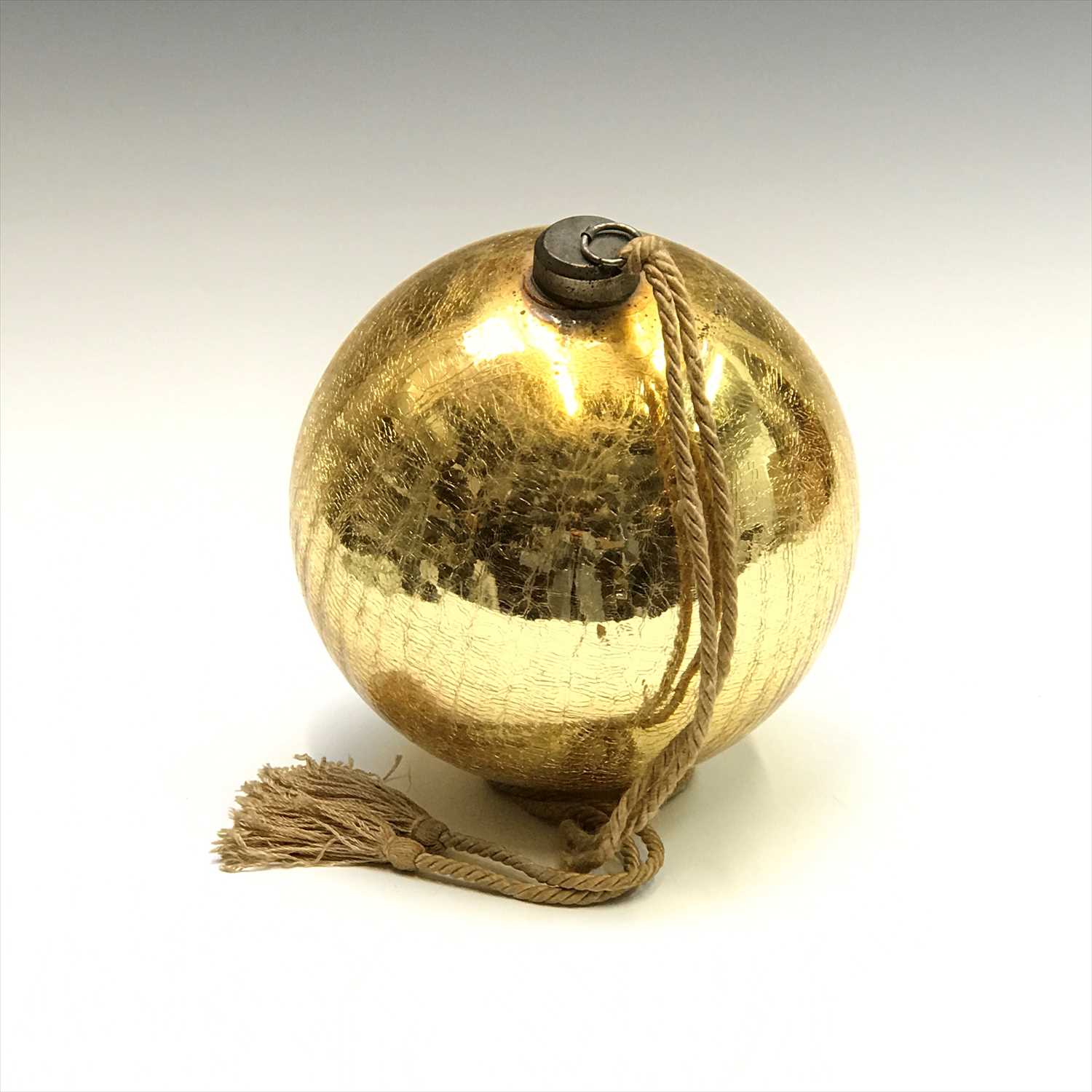 Lot 2 - A Victorian gold glass witch ball. Height...
