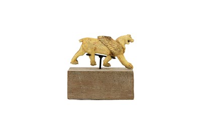 Lot 1062 - A Phoenician bone plaque of a winged lion.