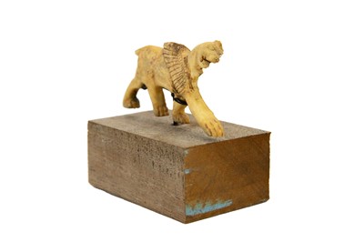 Lot 1062 - A Phoenician bone plaque of a winged lion.